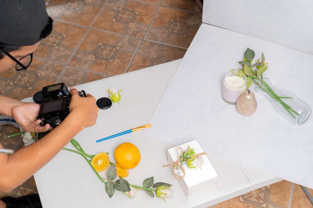 photographer preparing mirrorless camera for product photography session